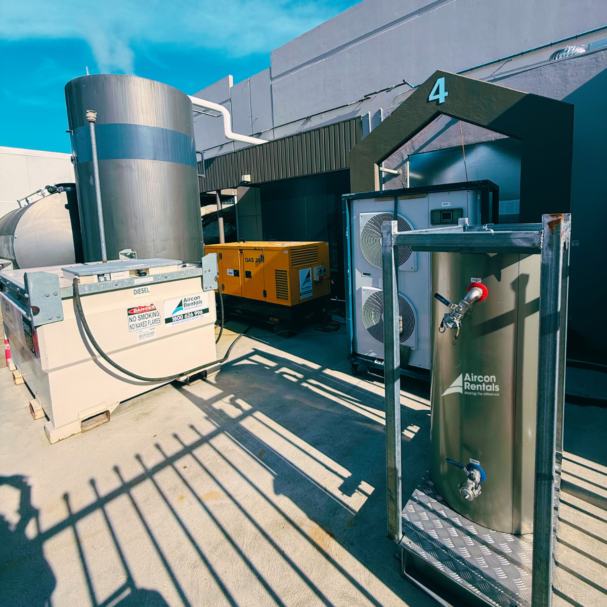 Temporary cooling setup featuring a 21kW air-cooled chiller, portable fan coil unit, and a 28kVA generator, ensuring efficient cooling for a dairy production facility in Melbourne.